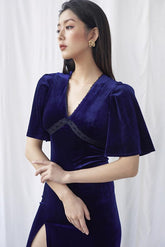Velvet wrap midi dress with flutter sleeves and high slit for elegant evening styling